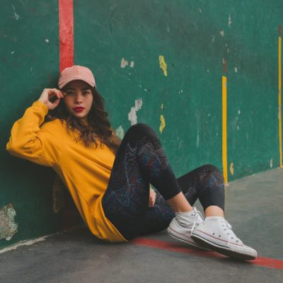 mockup-of-a-girl-wearing-big-fractal-yoga-leggings-sitting-on-the-floor-against-a-green-wall mockup-of-a-girl-wearing-big-fractal-yoga-leggings-sitting-on-the-floor-against-a-green-wall